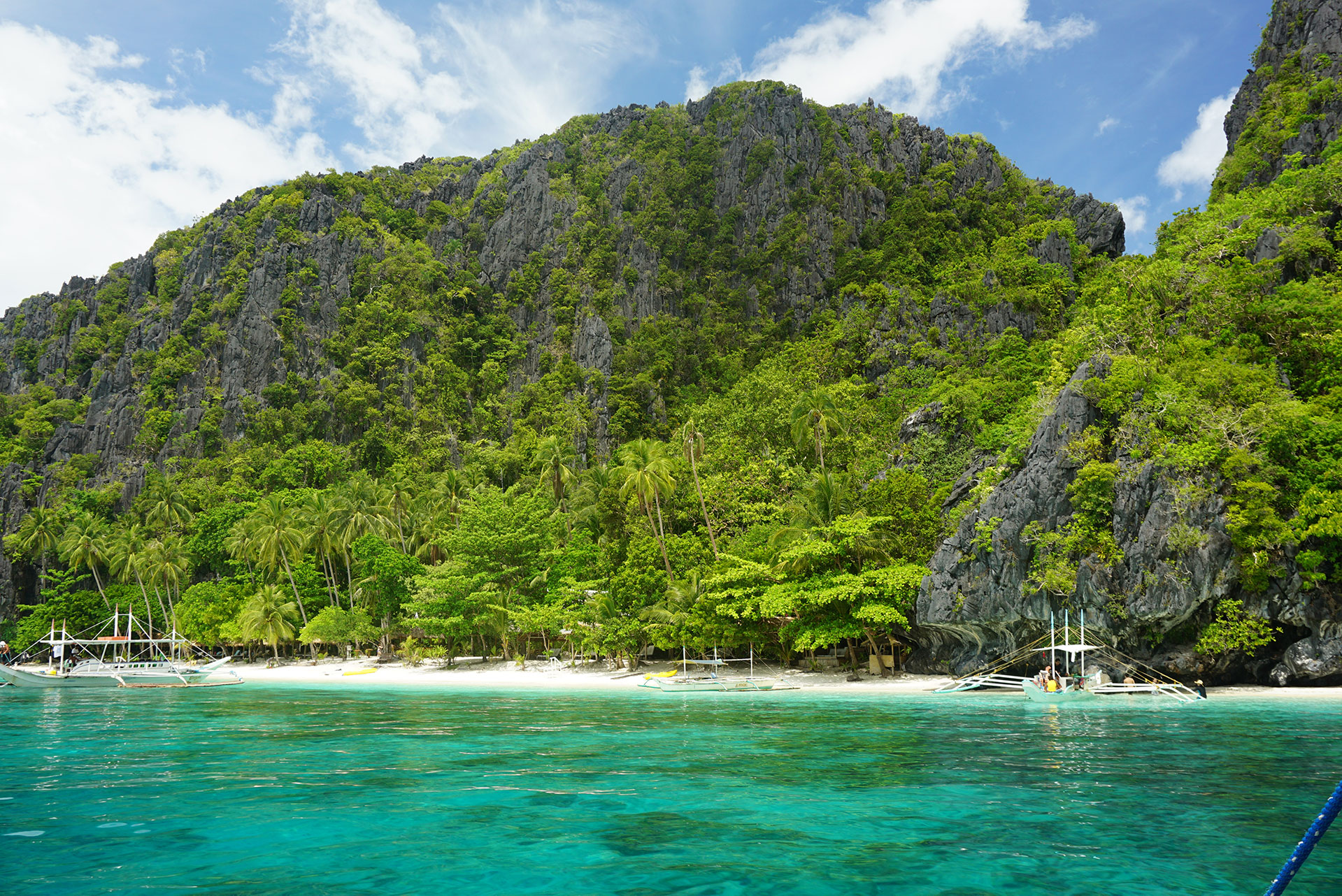 turquoise water with green hills Philippines