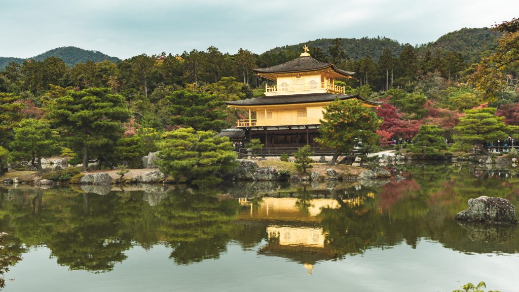 Golden Temple behind lake in Japan