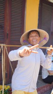 Vietnamese woman with peace sign in Hoi An