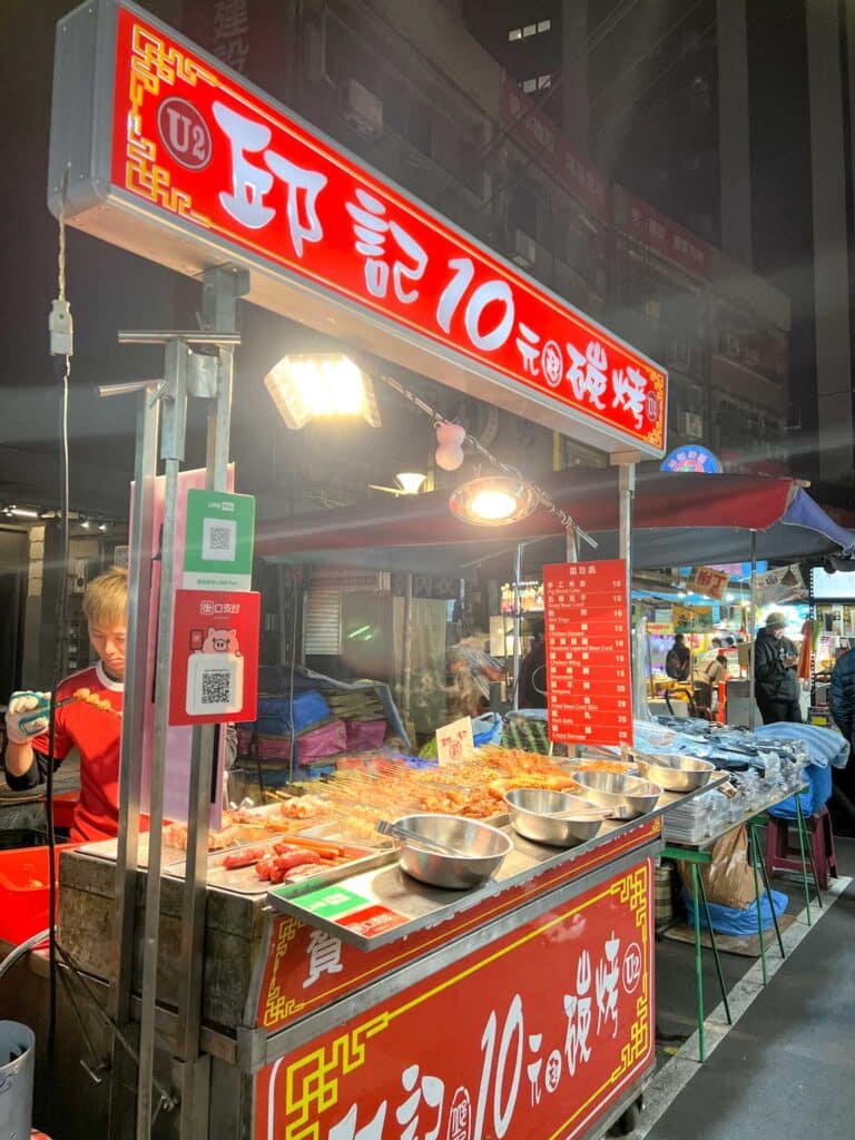 food stall with meat on stick in Taipei